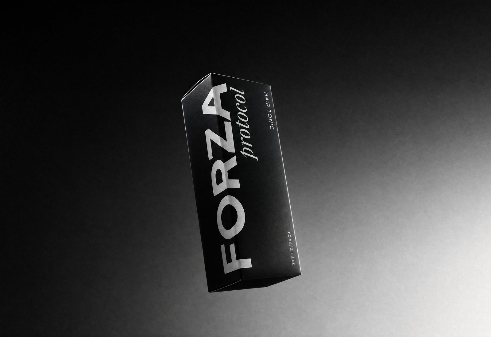 Caja de FORZA Hair Tonic flotando sobre fondo negro